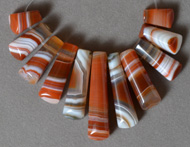 Trapezoid shaped beads from red and white agate.