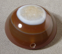 Bullseye agate pendant bead with quartz druzy in center.