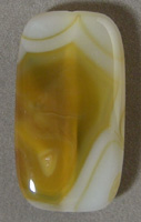 Pendant bead from yellow, brown and white Queensland agate.