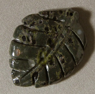 Carved leaf pendant bead from plumite jasper.