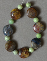 Short strand of serpentine round and pietersite flat round beads.