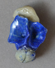 Lapis lazuli carved flower and bird pendant.