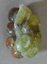 Carved squirrel pendant bead from green opal.