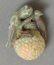 Two carved birds from spiderweb agate as pendant bead.