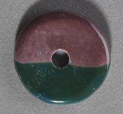 Rhodonite and agate Tai Ki pendant bead.