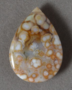 Brown and white ocean jasper teardrop bead.