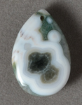 Green and white ocean jasper teardrop bead.