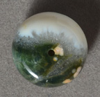 Large green and white ocean jasper rondelle bead.
