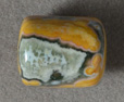 Green and yellow ocean jasper drum bead.
