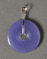 Sugilite pendant with sterling silver bale.