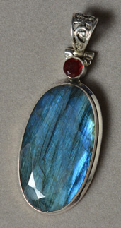 Faceted labradorite pendant with silver bale.