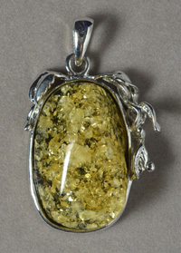 Amber pendant with white gold plated bezel and bale.