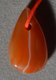 Tear drop shaped small agate pendant bead.