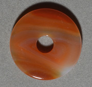 Red and white agate donut bead.