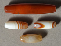 Several agate barrel beads.