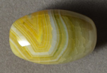 Yellow and white agate barrel bead.