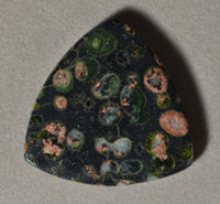 Rounded triangle pendant bead from plumite jasper.