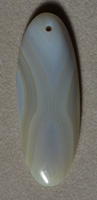 Piranha agate long oval pendant bead.