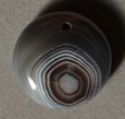 Small Botswana agate round pendant bead.