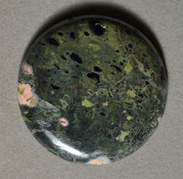 Plumite jasper round pendant bead.