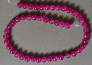 6mm round beads from purple jade.