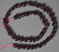 Small nugget beads from clear red garnet.