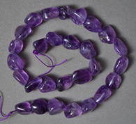 Tumbled nugget beads from amethyst.
