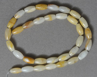 Natural golden cream quartz barrel shape beads.