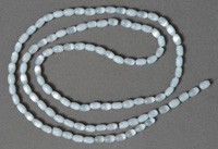 White cats eye glass large rice shaped beads.