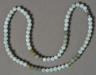 Green jade necklace with 6mm round beads.