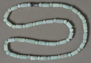 Jadeite jade drum and round beads.
