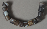 Brown and white Tibetan agate drum beads.