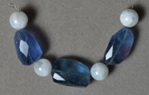 Blue fluorite faceted nugget beads and moonstone round beads.