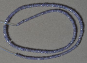 Medium blue colored tanzanite rondelle beads.