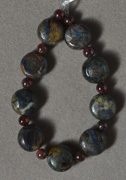 Nine lighter blue pietersite beads.