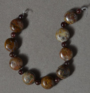 Brown pietersite flat round beads.