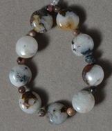 White opal pietersite flat round beads.