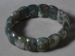 Eight inch bracelet from green moss agate with white opal.