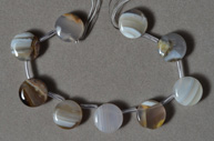 Cabochon like coin beads from Mexican agate.