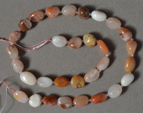 Red and white chalcedony nuggets strand.
