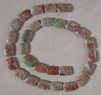 Rectangle beads from ruby in the mineral fuschite matrix.