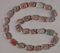 Navette and rectangle bead strand from ruby in fuschite matrix.