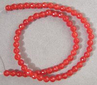 Strand of faceted round beads from red ruby.