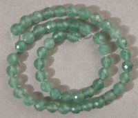 Larger emerald faceted round beads.