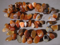 Tumbled nugget beads from carnelian with agate.