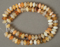 Rondelle beads from mixed shades of carnelian.