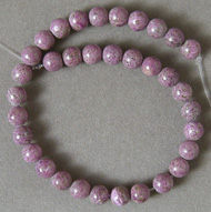 Small strand of 6mm purpurite round beads.