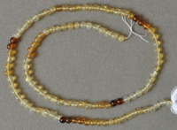 Small round beads from hessonite garnet.