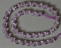 Six sided oval beads from amethyst.