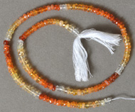 Small fire Opal rondelle beads in several shades.